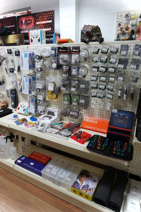 Combat robot parts on the shelf at the Rising Sun FPV store