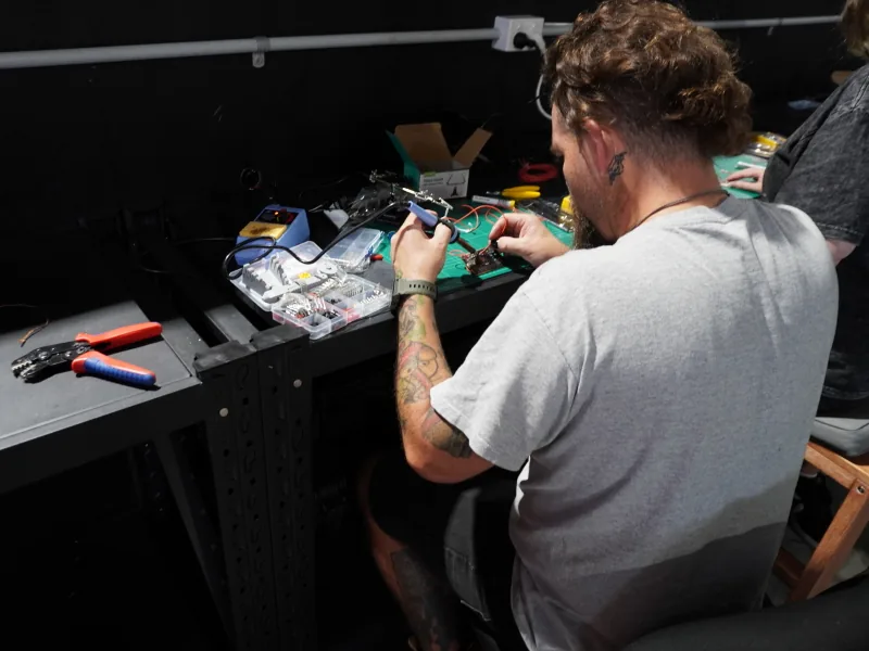 Club member soldering at a Jaycar-sponsored station during the first Learn to Solder session